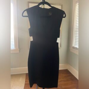 Nicole Miller black cocktail dress with cutouts. Size 0.